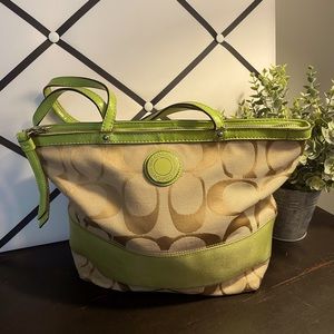 Coach signature handbag shoulder bag tote light green handles and accents.